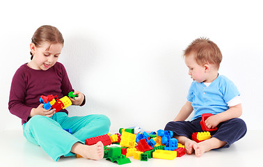 Image showing Adorable kids playing with blocks