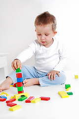 Image showing Lovely boy playing with blocks