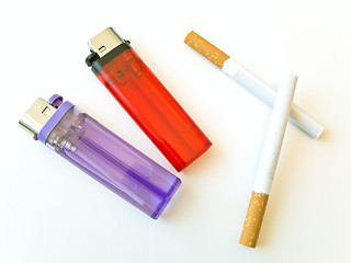 Image showing Two lighters and cigarettes