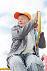 Image showing Boy on climbing staircase looking sideways