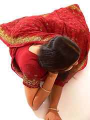 Image showing Indian lady in red dress.