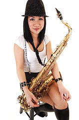 Image showing Chinese girl playing the saxophone.