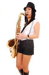 Image showing Chinese girl playing the saxophone.