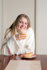 Image showing young woman having breakfast