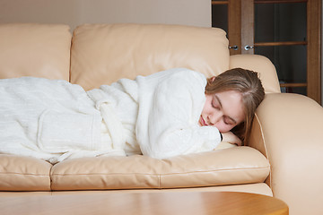 Image showing young woman asleep on sofa