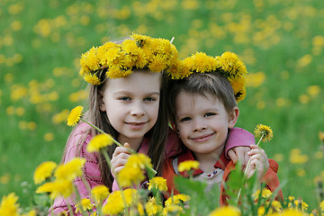 Image showing Brother and sister with dandelion garlands