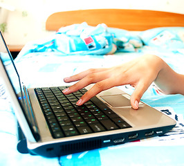 Image showing Female hands typing on a laptop