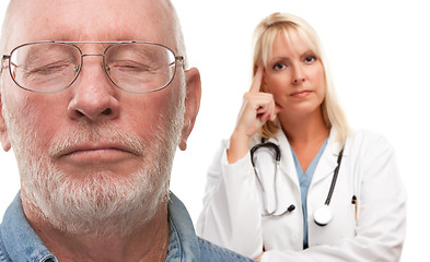 Image showing Concerned Senior Man and Female Doctor Behind