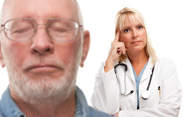 Image showing Concerned Senior Man and Female Doctor Behind
