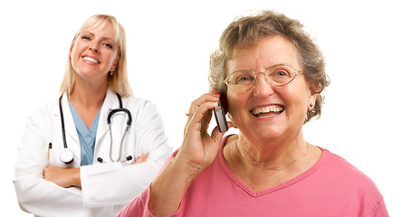 Image showing Happy Senior Woman Using Cell Phone with Female Doctor Behind