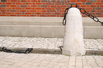 Image showing ancient rusty chain and stone column