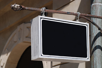 Image showing sign henging on a wall 