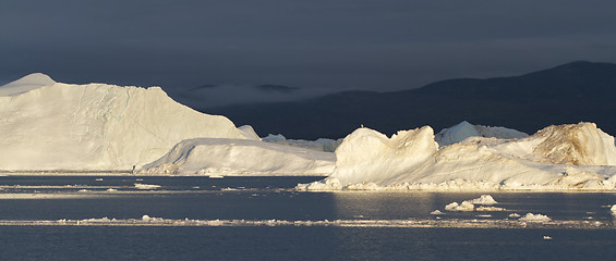 Image showing Icebergs in sunset