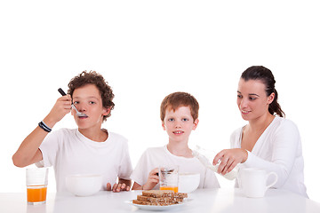 Image showing cute boys and mother taking breakfast