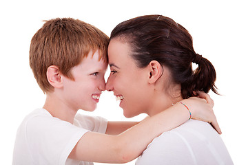 Image showing mother and son embracing cheek to cheek 