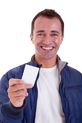 Image showing Portrait of a handsome man, with blank business card in hand