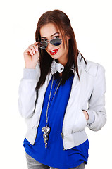 Image showing Girl with white jacket and sunglasses.