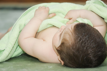 Image showing Baby covered with towel