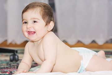 Image showing Smiling infant on floor