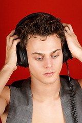 Image showing Disc jockey with earphones