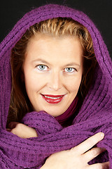 Image showing Blond woman with purple woolen scarf
