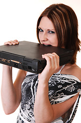 Image showing A young girl angry at her laptop.