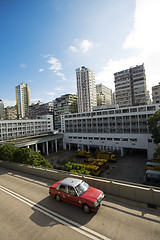 Image showing taxi passing the road in city