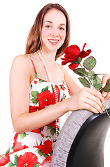 Image showing Pretty girl in dress with rose.