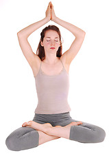 Image showing Young woman doing yoga.