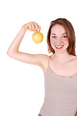 Image showing Young girl holding up apple.