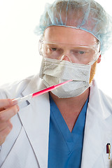 Image showing Man holding a pipette