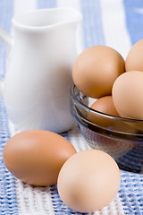 Image showing  eggs in a bowl and milk