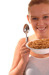 Image showing Smiling woman with cereal.