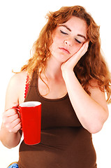 Image showing Sleeping girl with coffee.