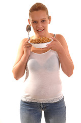 Image showing Smiling woman with cereal.