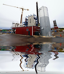 Image showing construction site, new bio fuel power plant  with reflection