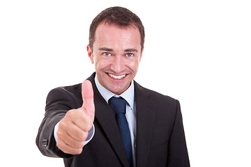 Image showing handsome businessman with thumb raised as a sign of success