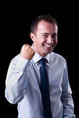 Image showing Portrait of a very happy  businessman with his arm raised