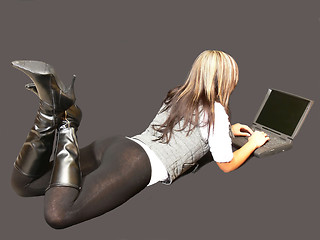 Image showing Young lady lying in tights.