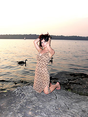 Image showing Lady on the lake in sunset 