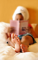 Image showing Teenage girl reading a book