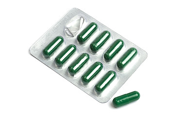 Image showing Green capsules packed in blister