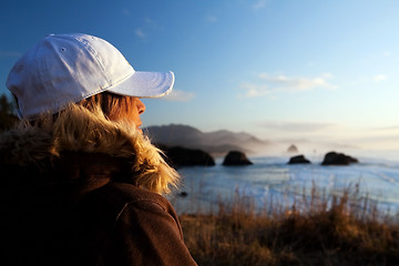 Image showing woman at coast overlooking ocean