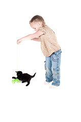 Image showing Little girl playing with kitten