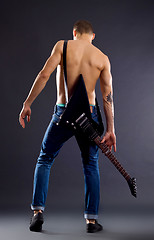 Image showing back of a guitarist