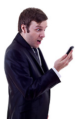 Image showing man looking at phone astonish