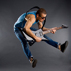 Image showing guitar player jumps