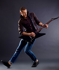 Image showing awesomen guitar player