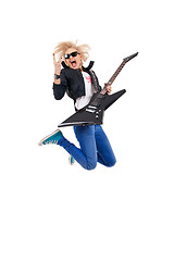 Image showing woman guitarist jumps