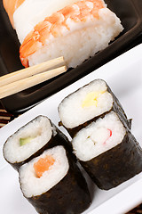 Image showing Assorted sushi with chopsticks